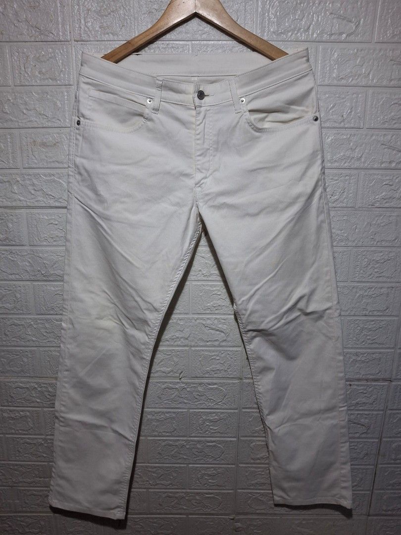 Edwin White Denim Jeans For Men (Category: Jeans) located in Angeles City. Submitted by livemountain.e2ae07 (Listing ID 1468572478, Image 1). Description: - Brand: Edwin - Color: White - W17 L40.2 HEM 8 - Style: Classic straight leg - Details: Metal button closure, branded hardware, brown leather back patch, and iconic orange logo tag on rear pocket - Material: Sturdy denim - Condition: Good, with a faint yellowish stain near the front button clo