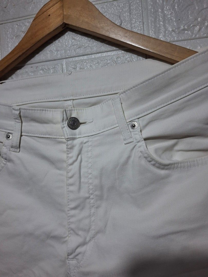 Edwin White Denim Jeans For Men (Category: Jeans) located in Angeles City. Submitted by livemountain.e2ae07 (Listing ID 1468572478, Image 2). Description: - Brand: Edwin - Color: White - W17 L40.2 HEM 8 - Style: Classic straight leg - Details: Metal button closure, branded hardware, brown leather back patch, and iconic orange logo tag on rear pocket - Material: Sturdy denim - Condition: Good, with a faint yellowish stain near the front button clo