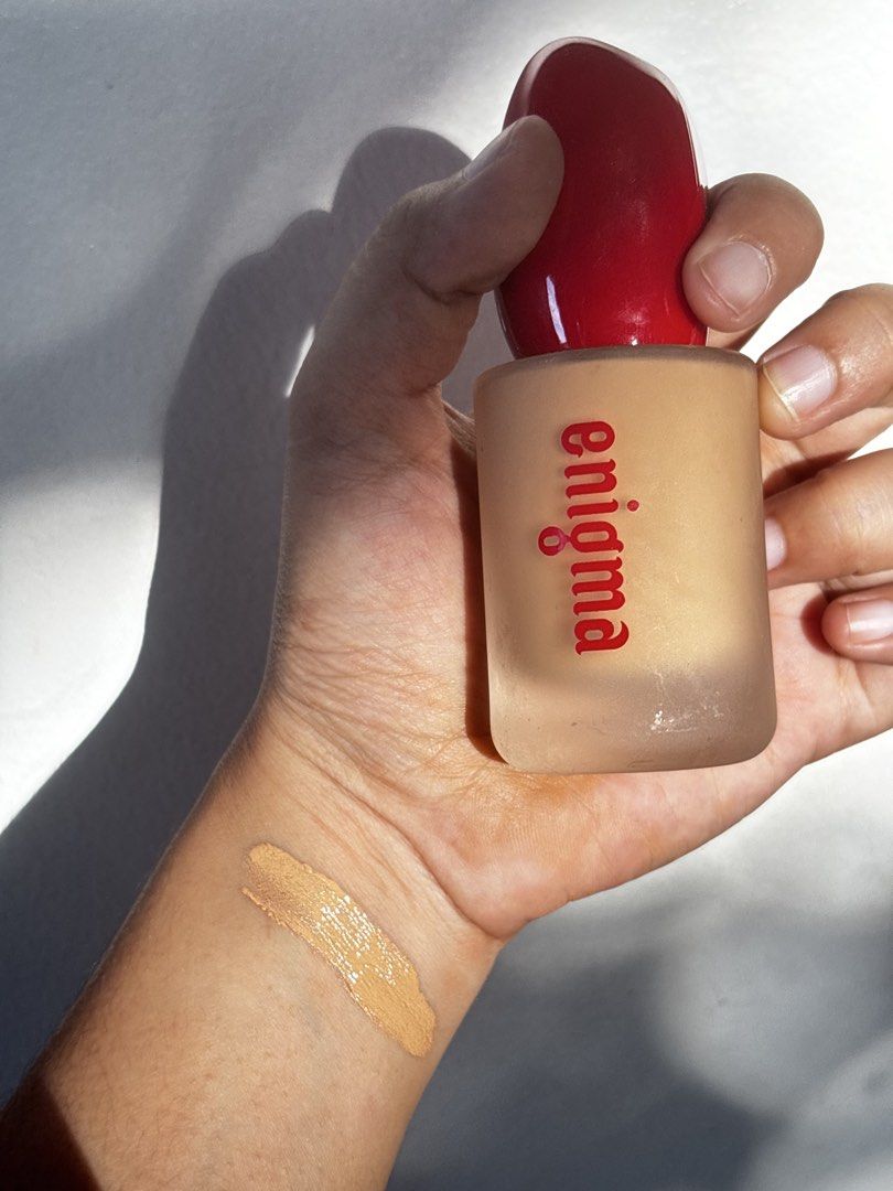 Enigma Foundation MN12 Medium Beige 30ml (Category: Makeup) located in Mandaluyong City. Submitted by cheskashopping (Listing ID 1468575463, Image 1). Description: - Brand: Enigma Liquid Foundation - Shade: MN12 Medium Beige (great for everyday wear) - Size: 30ml frosted glass bottle with red cap - Condition: Used once RFS not my shade.