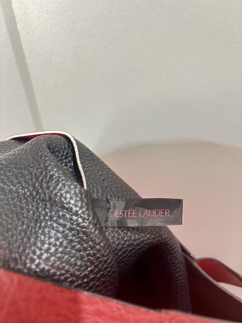 Estée Lauder Red Bag (Category: Shoulder Bags) located in Manila. Submitted by keyttttt_keyttttt (Listing ID 1468534248, Image 2). Description: Selling this beautiful red bag as part of my decluttering! ✔️ Good as new ✔️ Seldom used ✔️ Leather material ✔️ Has a nice, structured feel — mabigat na siya kahit walang laman because of the leather material itself! The red color gives it a classy and elegant look, perfect for anyone who loves statement 
