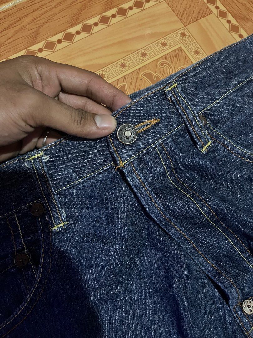 Evisu Denim Jeans Button Fly Dark Wash (Category: Jeans) located in Kidapawan. Submitted by azythrift (Listing ID 1468695821, Image 2). Description: - Brand: Evisu - Color: Deep blue indigo (Raw denim texture) - Material: 100% Cotton with visible selvedge ID - Fit: Standard straight leg - Details: Classic button fly with branded hardware - Condition: Clean interiors and original tags intact.