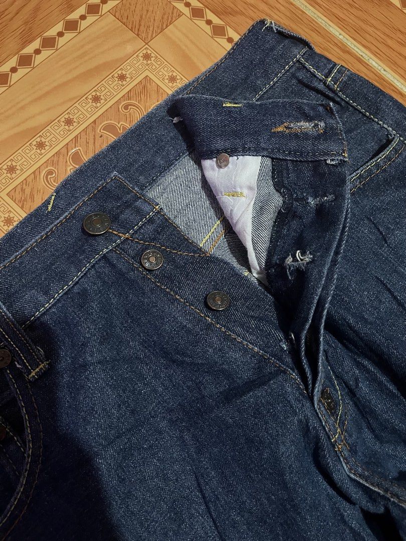 Evisu Denim Jeans Button Fly Dark Wash (Category: Jeans) located in Kidapawan. Submitted by azythrift (Listing ID 1468695821, Image 3). Description: - Brand: Evisu - Color: Deep blue indigo (Raw denim texture) - Material: 100% Cotton with visible selvedge ID - Fit: Standard straight leg - Details: Classic button fly with branded hardware - Condition: Clean interiors and original tags intact.