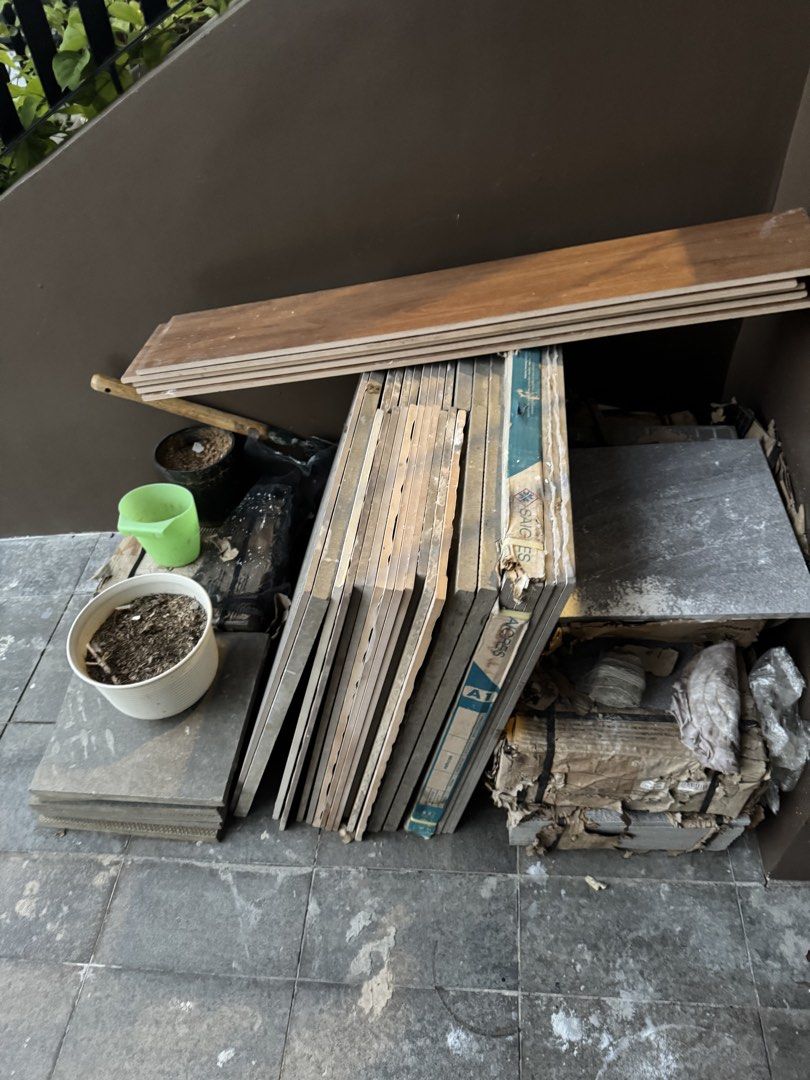 Excess Assorted ceramic floor tiles and bundles (Category: Carpets, Mats & Flooring) located in Cavite. Submitted by CLKSC (Listing ID 1468592530, Image 2). Description: - Bundle includes: Stack of grey patterned ceramic tiles, a few loose pieces, and several wood-look planks - Condition: Dusty from storage, but solid and usable - Best for: Small DIY projects, floor patching, or crafting tabletops - Sale terms: Take everything together (no tingi)