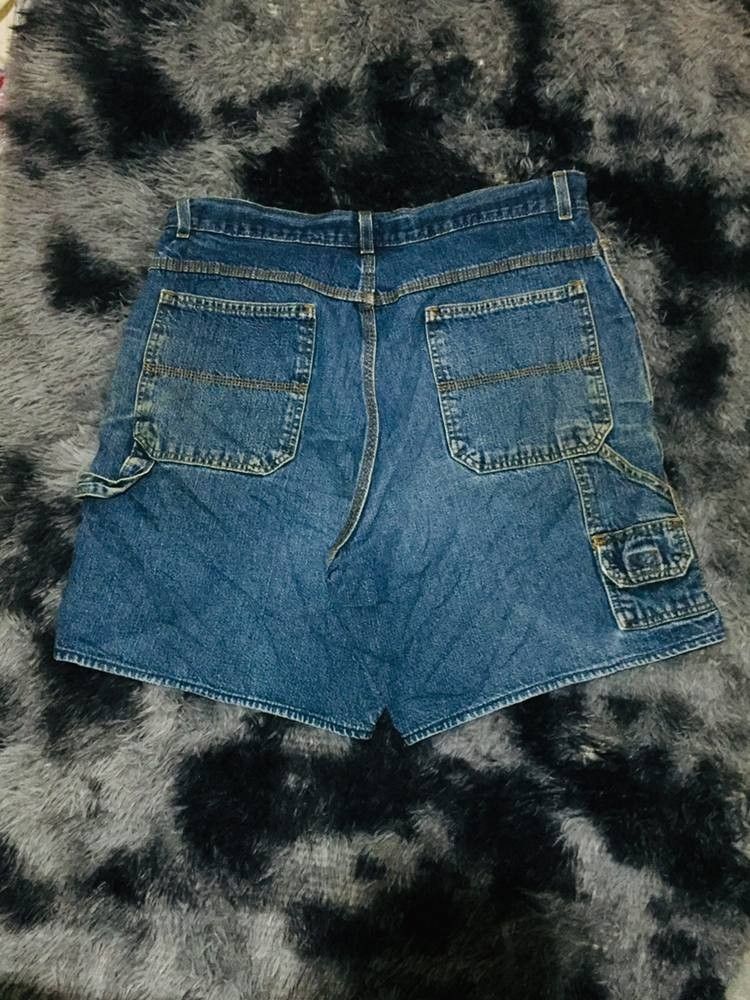 Faded Glory Denim Cargo Short Size 36 (Category: Shorts) located in Manila. Submitted by gentlecloud_713dbd (Listing ID 1468504315, Image 1). Description: - Brand/Model: Faded Glory denim cargo shorts - Color/Wash: Classic blue with a vintage faded finish - Fit: Relaxed fit with belt loops and button fly closure - Pockets: Functional utility pockets on sides and back - Material: Sturdy, durable cotton fabric - Style: Great staple piece for casual