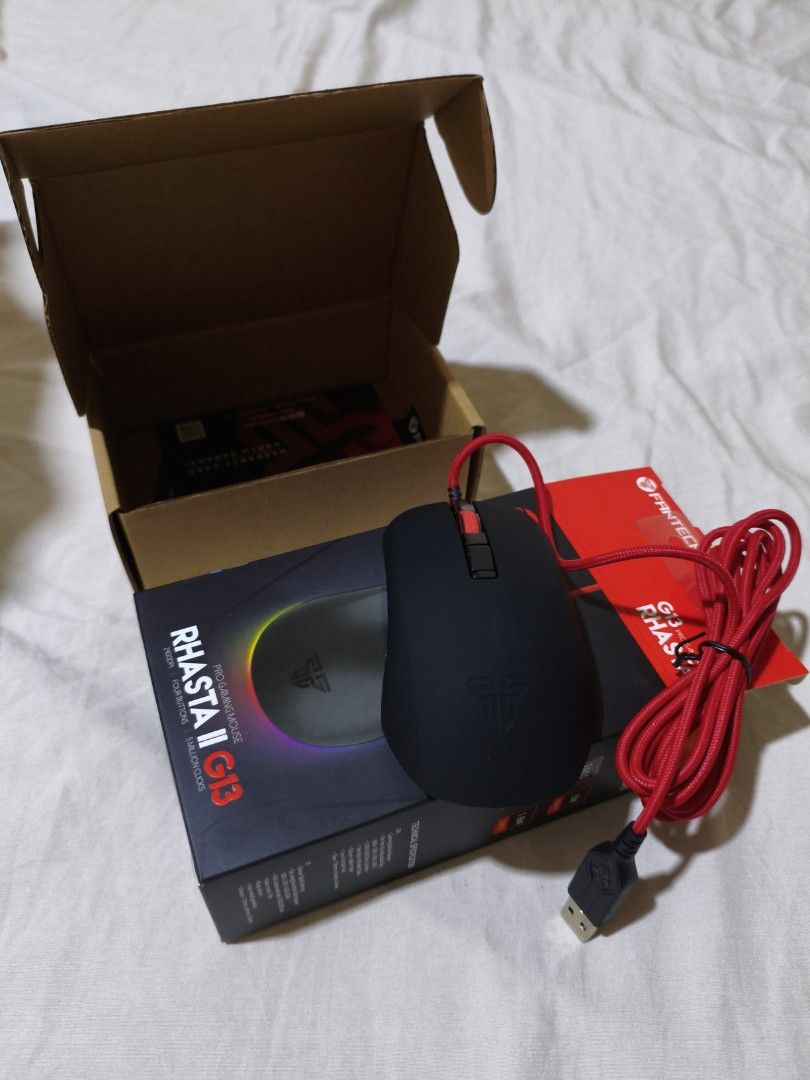 Fantech Rhasta II G13 Pro Gaming Mouse (Category: Mouse & Mousepads) located in Pasig City. Submitted by garage.sale89 (Listing ID 1468634523, Image 3). Description: - Model: Fantech Rhasta II G13 Pro Gaming Mouse - Color: Sleek Black - Sensor: Tournament-level optical sensor up to 2400 CPI - Durability: 4 buttons with 5-million-click lifetime switches - Design: Comfortable ambidextrous shape suitable for any grip style - Connectivity: Braided re