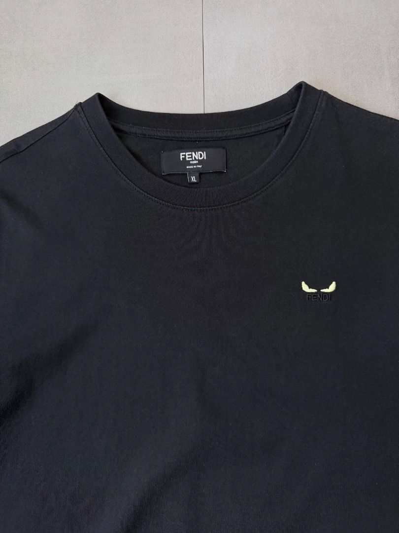 Fendi Black tee shirt (Category: Tshirts & Polo Shirts ) located in Cabanatuan. Submitted by argarments.ph (Listing ID 1468576410, Image 3). Description: Tagged: XL on tag Width 21" | Length 28" Condition: Excellent condition Issue(s): -.