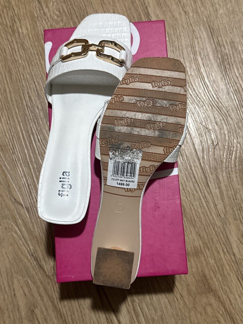 Figlia White Sandals with Gold Hardware Size 38 (Category: Flats & Sandals) located in Pasig City. Submitted by trixianicole (Listing ID 1468647099, Image 3). Description: - Brand: Figlia - Type: White slip-on sandals with square toe and low block heel - Details: Fux crock texture and elegant gold chain link on the strap - Size: 38 (as listed on sole sticker) - Inclusions: Original Sofab! pink shoebox included - Original Price: 1,499 PHP (bought 