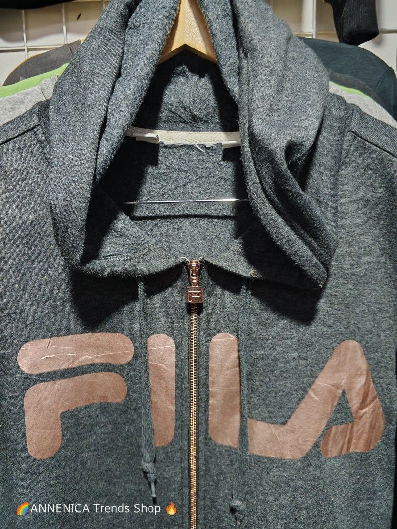 FILA BIG LOGO ZIP HOODIE (Category: Coats, Jackets and Outerwear) located in Bulacan. Submitted by annenicathriftthriftlang (Listing ID 1468513167, Image 2). Description: *FILA BIG LOGO ZIP HOODIE - CHARCOAL GRAY* *Size Large to XL - P400 ONLY!* *DIMES:* - Width: 22-23 inch (pit to pit) - Length: 27 inch - Sleeve: 24 inch - Fit: Medium to XL (oversized fit) *DETAILS:* - Rose Gold big FILA logo print + Rose Gold zipper hardware (rare colorway) - Z