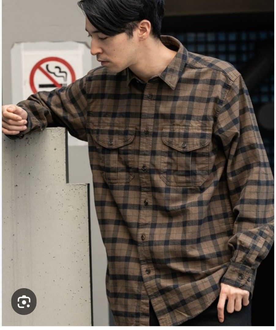 Filson Alaskan Guide Shirt (Category: Tshirts & Polo Shirts ) located in Santa Rosa. Submitted by y2kstylist (Listing ID 1467255565, Image 1). Description: - Brand: Filson - Style: Long sleeve button-down shirt - Pattern: Black and olive green plaid - Material: 100% breathable cotton - Features: Dual chest pockets with button flaps, standard collar, front button closure - Size: Large - Origin: Made in India - Condition: Excellent/Like new.