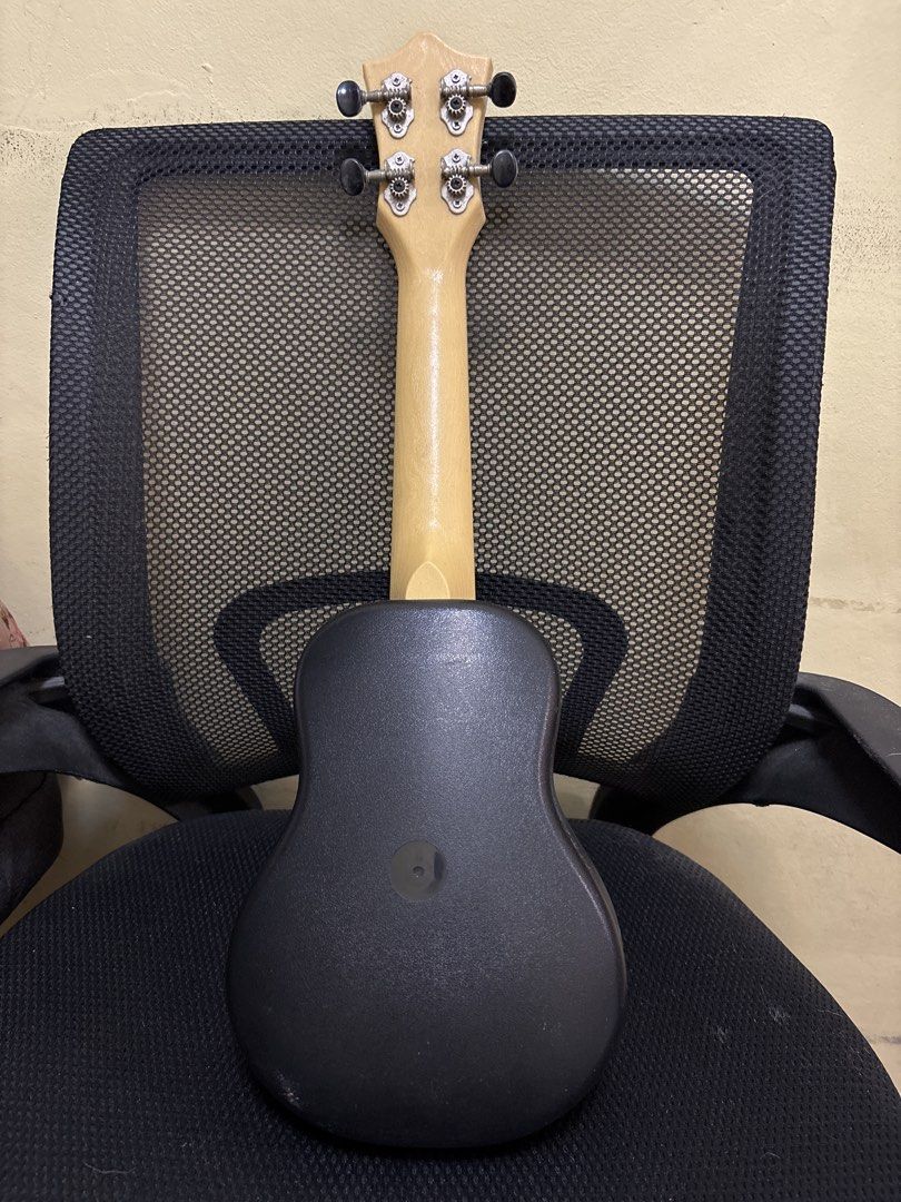 Flight TUS-35 NAT Travel Ukulele (Category: Musical Instruments) located in Malabon City. Submitted by luxgoals (Listing ID 1468520213, Image 2). Description: - Model: Flight TUS-35 NAT Travel Ukulele - Design: Natural wood top, black back/sides/neck, with cute flower fretboard markers - Condition: Body and neck are solid and intact - Notice: Missing 2 strings; tuning pegs have minor wear and rust spots - Ideal for: Beginners looking for a budget