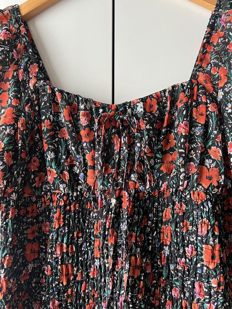 Floral Smocked Mini Dress (Category: Dresses) located in Mandaluyong City. Submitted by katecdp (Listing ID 1468690329, Image 3). Description: Smocked stretchy bodice with adjustable tie front detail. Cute black and orange floral pattern for casual wear. Lightweight fabric which doesnt crease!! 🩷 best fit for medium to large 🩷 👗 Seller reference: 5’5’ height, 34” bust, 29” waist 💸 MOP: GCash, BPI QR Decluttering my closet with items mostly us