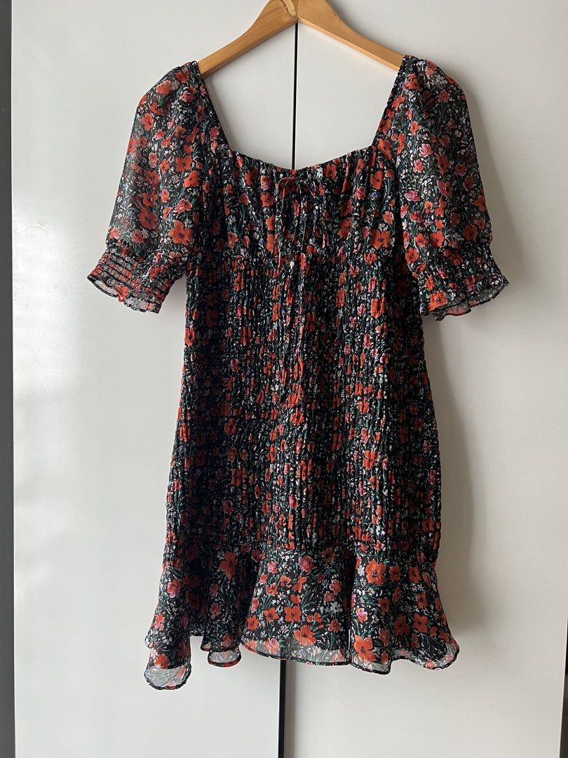 Floral Smocked Mini Dress (Category: Dresses) located in Mandaluyong City. Submitted by katecdp (Listing ID 1468690329, Image 1). Description: Smocked stretchy bodice with adjustable tie front detail. Cute black and orange floral pattern for casual wear. Lightweight fabric which doesnt crease!! 🩷 best fit for medium to large 🩷 👗 Seller reference: 5’5’ height, 34” bust, 29” waist 💸 MOP: GCash, BPI QR Decluttering my closet with items mostly us