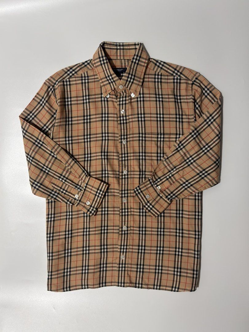 For sale (Category: Longsleeves) located in Marikina City. Submitted by hsatstnemesabeht (Listing ID 1468633047, Image 1). Description: Vtg burberry plaid Size 40 Dimension Width 22 | Length 27.5 Excellent condition Flaws : All buttons repair the owner check last pic .