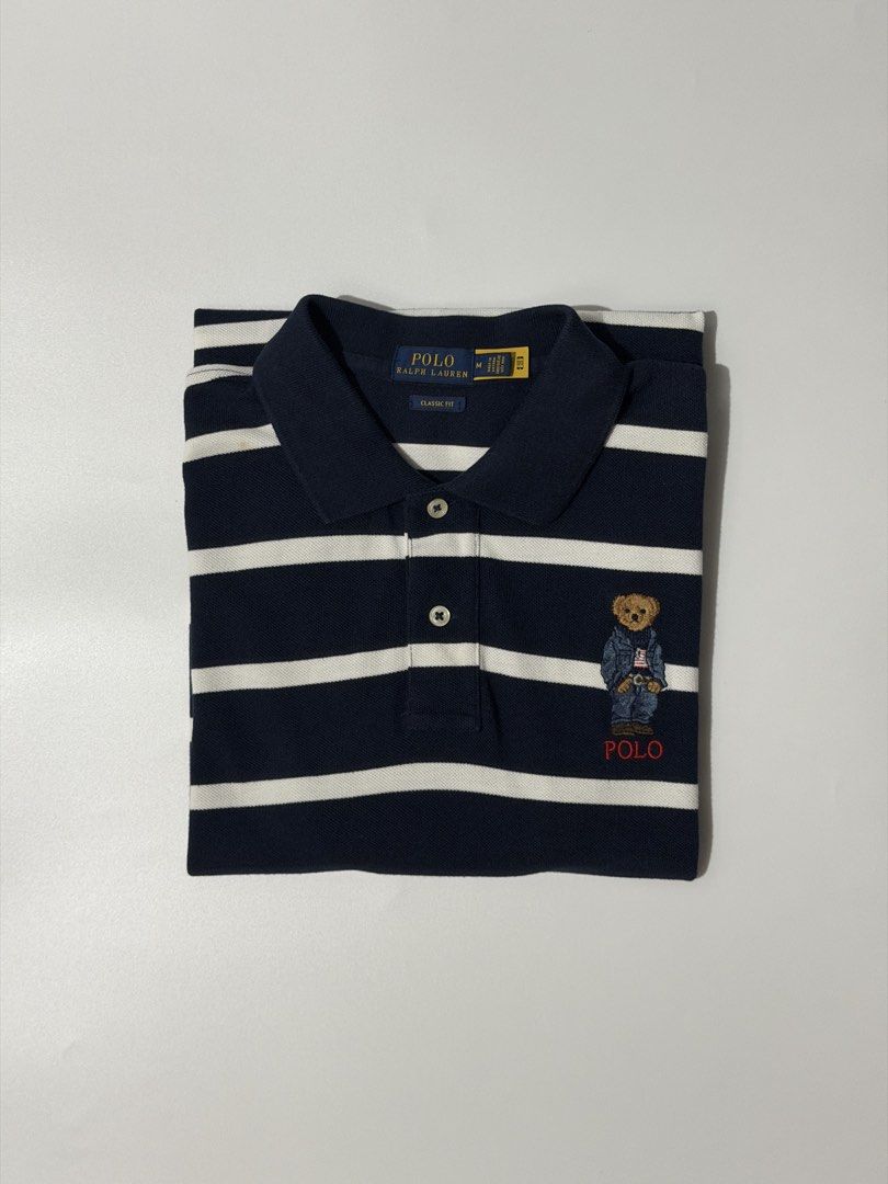 For sale (Category: Shirts) located in Marikina City. Submitted by skkagawad041591 (Listing ID 1468635908, Image 1). Description: PRL classic fit polo bear polo shirt Size medium Dimension Width 18 | Length 26.5 | Back 27.5 Like new Flaws : Stain sa mga white part needwash.
