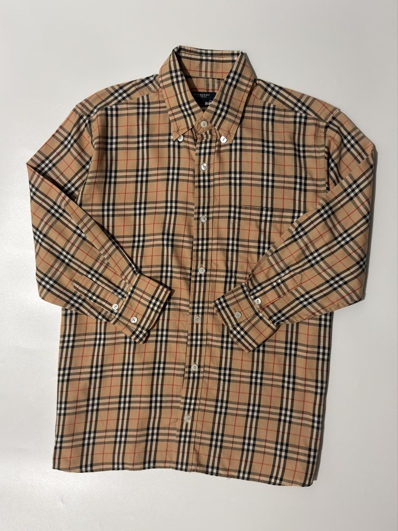 For sale (Category: Longsleeves) located in Marikina City. Submitted by skkagawad041591 (Listing ID 1468637074, Image 2). Description: Vtg burberry plaid Size 40 Dimension Width 22 | Length 27.5 Excellent condition Flaws : All buttons repair the owner check last pic.
