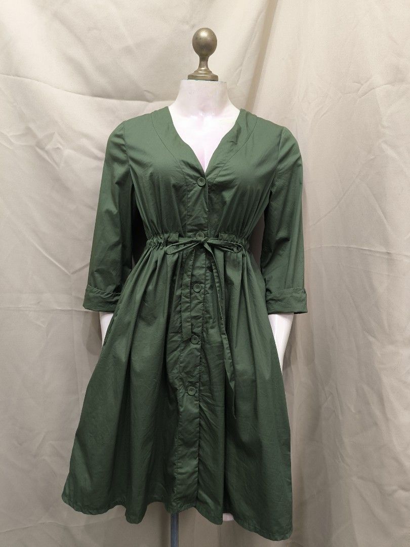 Forest Green Midi Dress with Belt (Category: Dresses) located in Marikina City. Submitted by mrlfashion23 (Listing ID 1468596306, Image 1). Description: - Color: Rich forest green - Style: V-neck midi dress with button-down front - Fit: Includes matching fabric waist tie for a customized silhouette - Sleeves: Three-quarter length with stylish folded cuffs - Length: Mid-length flare skirt falling right below the knees - Material: Lightweight, brea