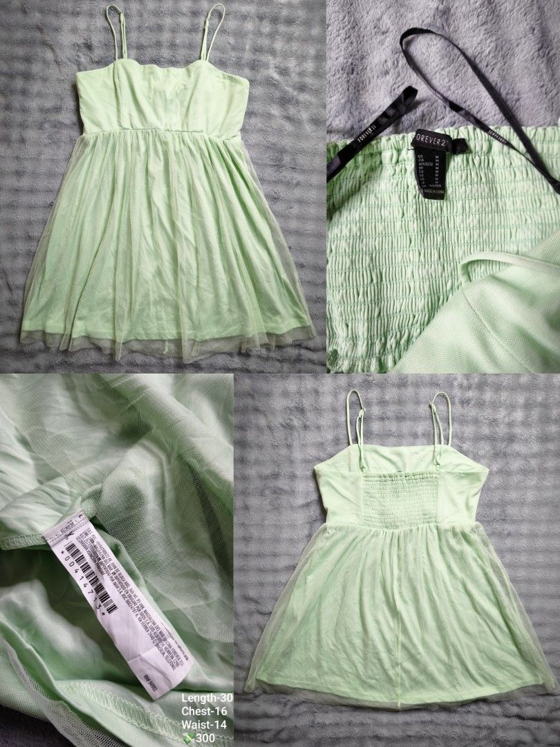 Forever 21 Light Green Mesh Cami Dress (Category: Dresses) located in Floridablanca. Submitted by vintager12 (Listing ID 1468542383, Image 1). Description: - Brand: Forever 21 - Condition: Like new with original tags attached - Size: Medium (M) - Color: Mint Green - Details: Adjustable spaghetti straps, stretchy smocked back panel for comfort, and a sheer mesh skirt overlay - Measurements: Length 30", Chest 16", Waist 14".