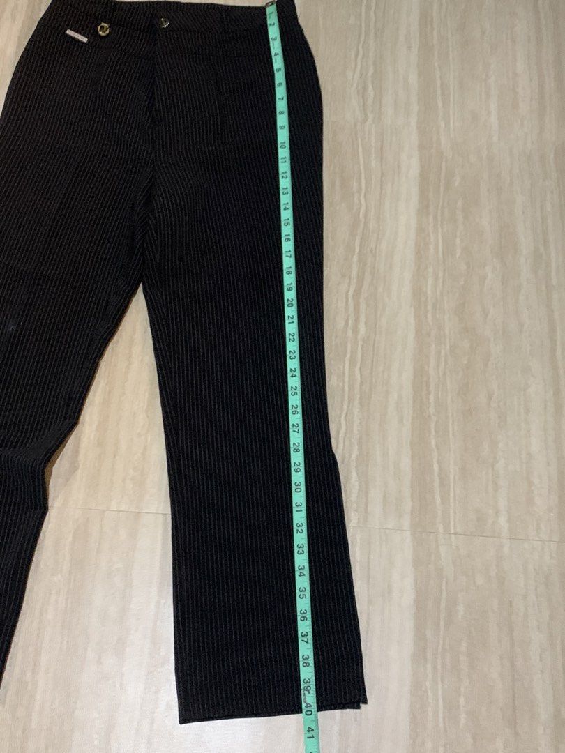 Formal Stripped Black Pants Office Bootcut Pants with Slit (Category: Jeans) located in Abucay. Submitted by charkolefishies (Listing ID 1468545878, Image 2). Description: Black Stripped Pants Suits Formal Attire, Office, Casual, Smart Casual Has a cool slit at the bottom, goes well with boots and heels Never Worn Thick and great quality fabric Has a bit of powder like stain from cabinet Measurements in pictures!!.