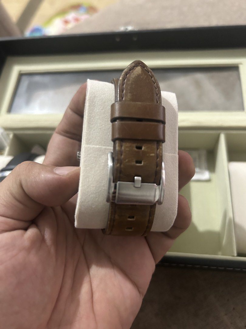 Fossil watch (Category: Men's Watches) located in Caloocan City. Submitted by chewy1129 (Listing ID 1468548292, Image 3). Description: - Bundle of two authentic Fossil watches - Watch 1: Silver-tone metal bracelet, white dial with red second hand, and three sub-dials (Clean condition) - Watch 2: Brown leather strap, champagne-colored dial with Roman numerals at 12 and 6, and three sub-dials (Shows minor creasing and wear near the tip) - Great eve