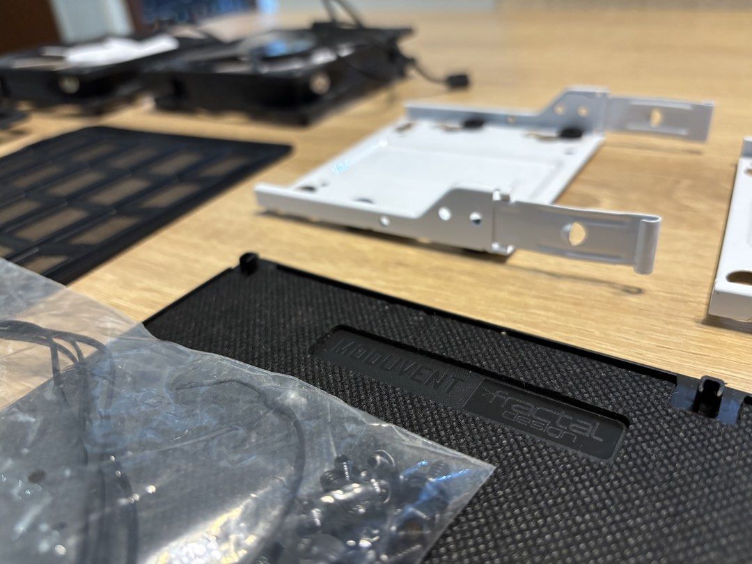 Fractal Design Moduvent PC Case Spare Parts Fans Brackets Filters (All for $10) (Category: Computer Parts) located in Singapore. Submitted by stevenlim87 (Listing ID 1468627824, Image 2). Description: - Authentic Fractal Design case spare parts from a custom build - 2x 140mm fans (black frames, white blades) - 2x White HDD/SSD drive trays - ModuVent sound damping cover - 2x Magnetic dust filters - Original mounting screws and zip ties included - 