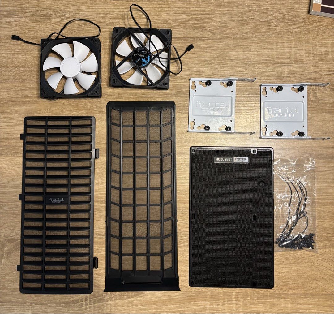 Fractal Design Moduvent PC Case Spare Parts Fans Brackets Filters (All for $10) (Category: Computer Parts) located in Singapore. Submitted by stevenlim87 (Listing ID 1468627824, Image 1). Description: - Authentic Fractal Design case spare parts from a custom build - 2x 140mm fans (black frames, white blades) - 2x White HDD/SSD drive trays - ModuVent sound damping cover - 2x Magnetic dust filters - Original mounting screws and zip ties included - 