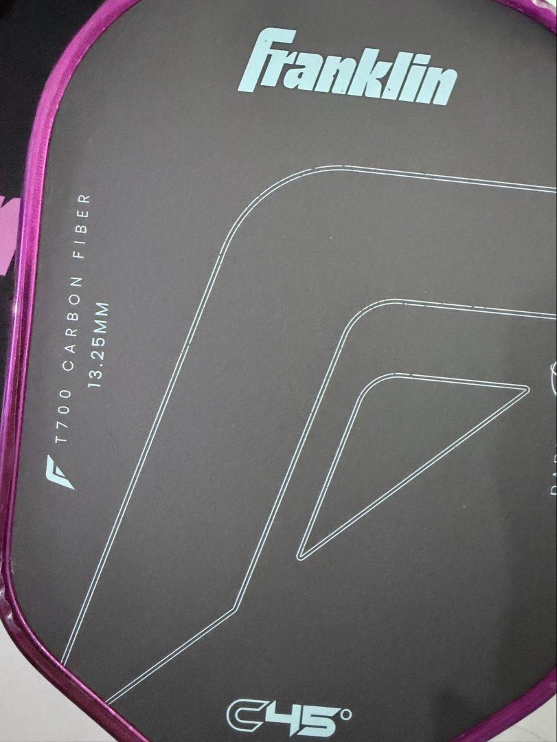 Franklin C45 Parris Todd (Category: Racket and Ball Sports) located in Manila. Submitted by naomithings (Listing ID 1468652469, Image 3). Description: • Dimensions & Shape: 16.3” long by 7.5” wide with an elongated shape. • Handle: 5.7” handle length with a ~4.15” to 4.25” grip circumference. • Core & Thickness: 13.25mm PowerFlex polymer core with an inner foam layer. • Face Material: T700 raw carbon fiber surface applied at a 45-degree peel-ply 