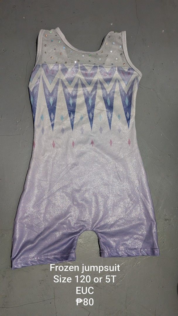 Frozen Jumpsuit Size 120 or 5T (Category: Babies & Kids Fashion) located in Tanay. Submitted by misyelleysim (Listing ID 1468611327, Image 1). Description: - Size: 120 (fits around 5T) - Design: Light purple with geometric snowflake prints - Details: Sheer mesh neckline with sparkly rhinestones - Fit: Short sleeves, athletic cut ideal for gymnastics or dance.