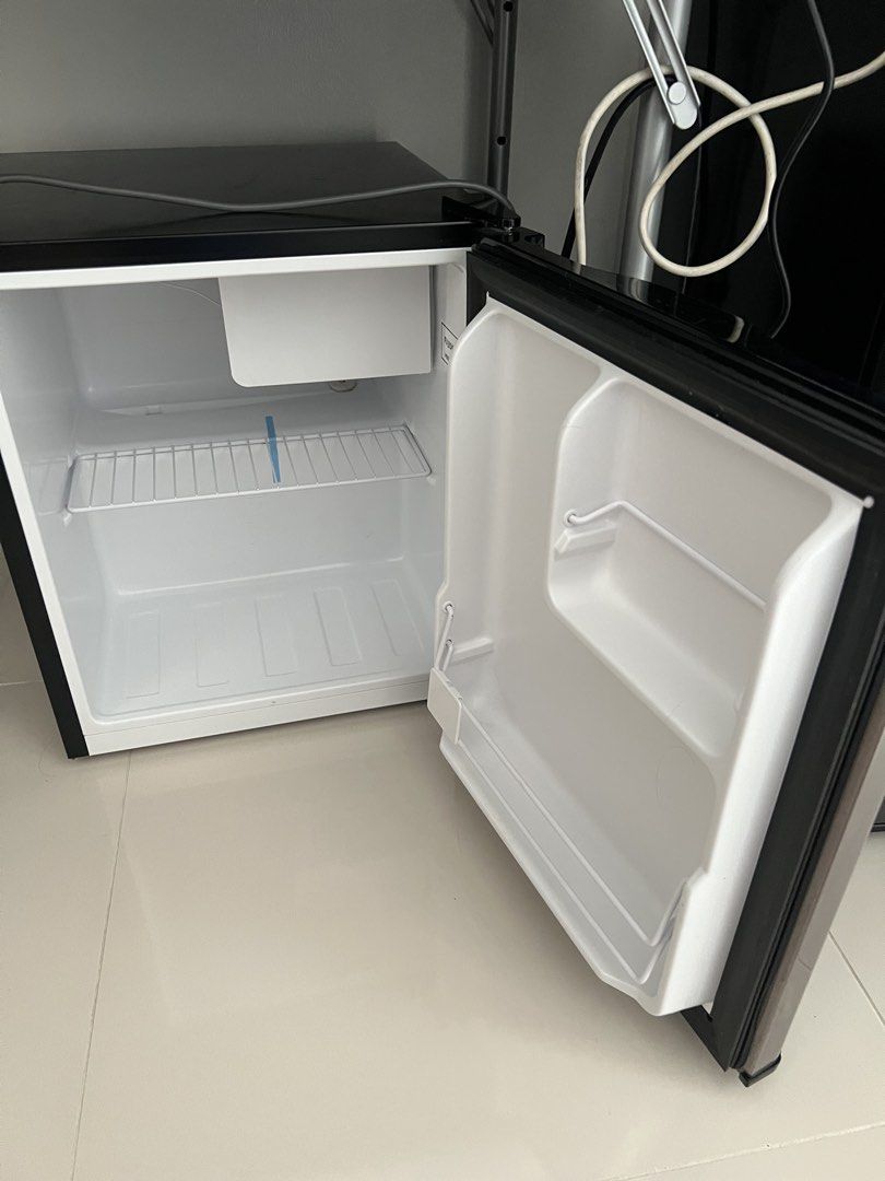 Fujidenzo Mini Refrigerator (Category: Refrigerators and Freezers) located in Quezon City. Submitted by hcpecson (Listing ID 1468524991, Image 2). Description: - Brand: Fujidenzo - Design: Sleek stainless steel door with black top trim - Interior: Single wire shelf with convenient door storage racks - Condition: Clean and ready for use - Ideal for: Bedrooms, offices, dorms, and small spaces - Performance: Efficiently keeps drinks cold FOR PICK UP