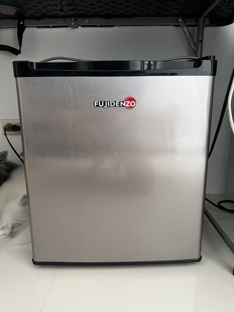Fujidenzo Mini Refrigerator (Category: Refrigerators and Freezers) located in Quezon City. Submitted by hcpecson (Listing ID 1468524991, Image 1). Description: - Brand: Fujidenzo - Design: Sleek stainless steel door with black top trim - Interior: Single wire shelf with convenient door storage racks - Condition: Clean and ready for use - Ideal for: Bedrooms, offices, dorms, and small spaces - Performance: Efficiently keeps drinks cold FOR PICK UP