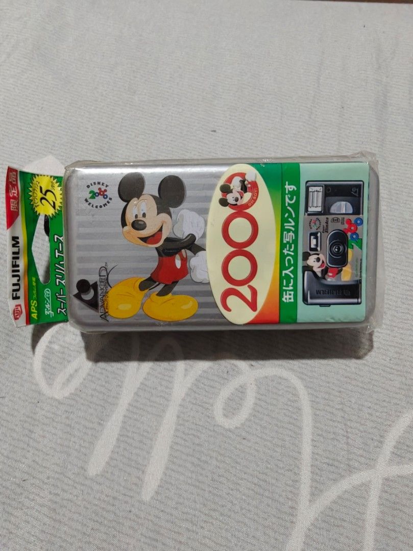 Fujifilm Disney 2000 Mickey Mouse APS Film Camera (Category: Cameras) located in Caloocan City. Submitted by mackenzie001 (Listing ID 1468651077, Image 1). Description: - Brand new, factory sealed in original packaging tin - Rare Fujifilm APS film camera featuring Mickey Mouse 2000 celebration graphics - 25 exposures, ISO 400 - Expiration date: August 2001 - Perfect collector's item for Disney fans and film camera enthusiasts.
