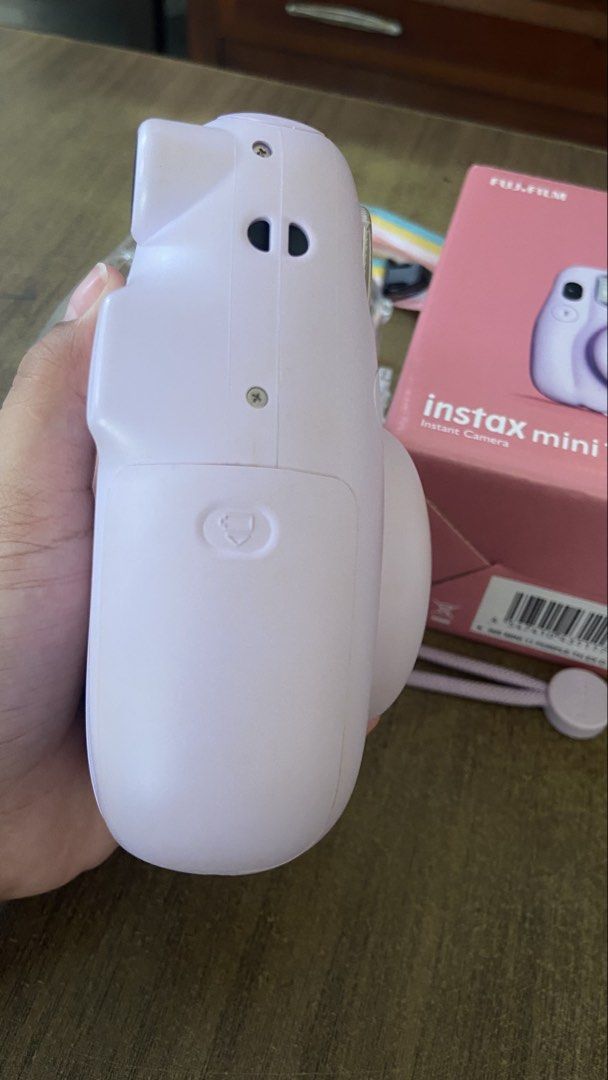 FUJIFILM Instax Mini 11 (Category: Cameras) located in Mabalacat. Submitted by purple.dust (Listing ID 1468551485, Image 3). Description: * Brand: Fujifilm * Model: Instax Mini 11 * Color: Lilac Purple * Type: Instant film camera * Condition: Excellent condition * Working condition: Fully functional, takes photos normally * Battery: Working * Inclusions: * Instax Mini 11 camera * Original box * Clear protective camera case * Purple wrist strap * 