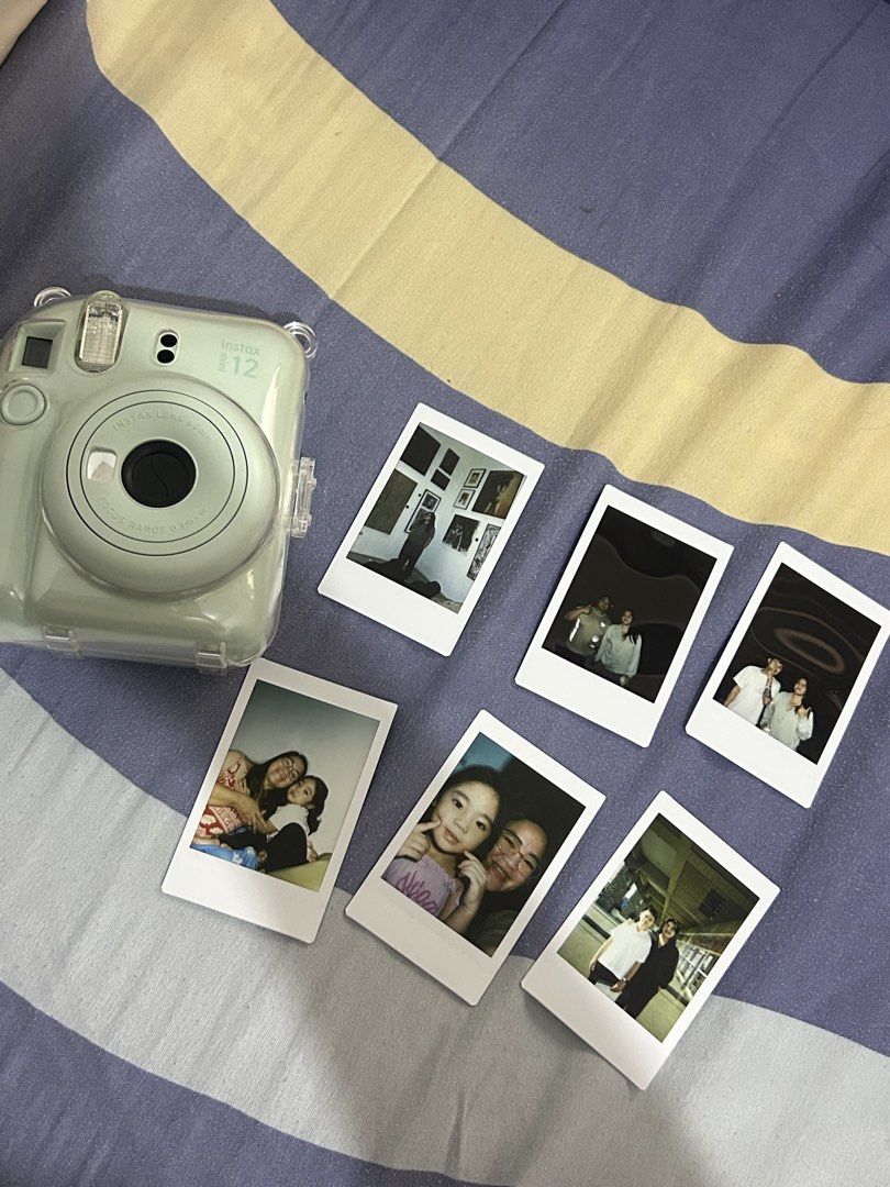 Fujifilm Instax Mini 12 Pastel Green with Case (Category: Cameras) located in Puerto Princesa. Submitted by kthjbs (Listing ID 1468520461, Image 3). Description: - Model: Fujifilm Instax Mini 12 - Color: Pastel Green - Condition: Tested and 100% working - Inclusions: Clear plastic protective case and matching wrist strap - Features: Prints great instant photos (sample shots shown in photos) - Ideal for: Trips, parties, and everyday snapshots - Re