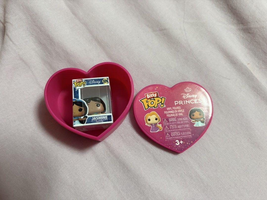 Funko Bitty Pop Disney Princess Jasmine (Category: Designer & Blind Box Toys) located in Quezon City. Submitted by ysabelmagno (Listing ID 1468688147, Image 2). Description: - RFS: Duplicate - Item: Funko Bitty Pop Disney Princess Jasmine (#326) - Condition: Brand new and in pristine condition - Inclusions: Original tiny window box, heart-shaped case, and clear acrylic display case ‼️Also open for trade Ariel/Merida/Cinderella/Aurora/Moana/Snow W