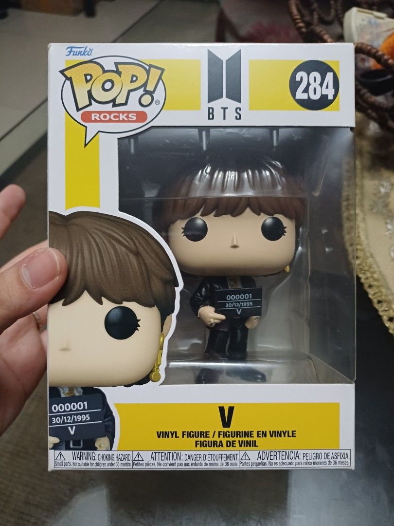 Funko Pop Rocks BTS V #284 Vinyl Figure (Category: Designer & Blind Box Toys) located in Taguig. Submitted by naxinator (Listing ID 1468601537, Image 1). Description: - Item: Funko Pop! Rocks - BTS V Vinyl Figure (#284) - Design: V holding a small placard with classic yellow box accents - Condition: Brand new, unopened box with clear plastic window view - Authenticity: 100% original and collector-friendly - Shipping: Packed securely with bubble w