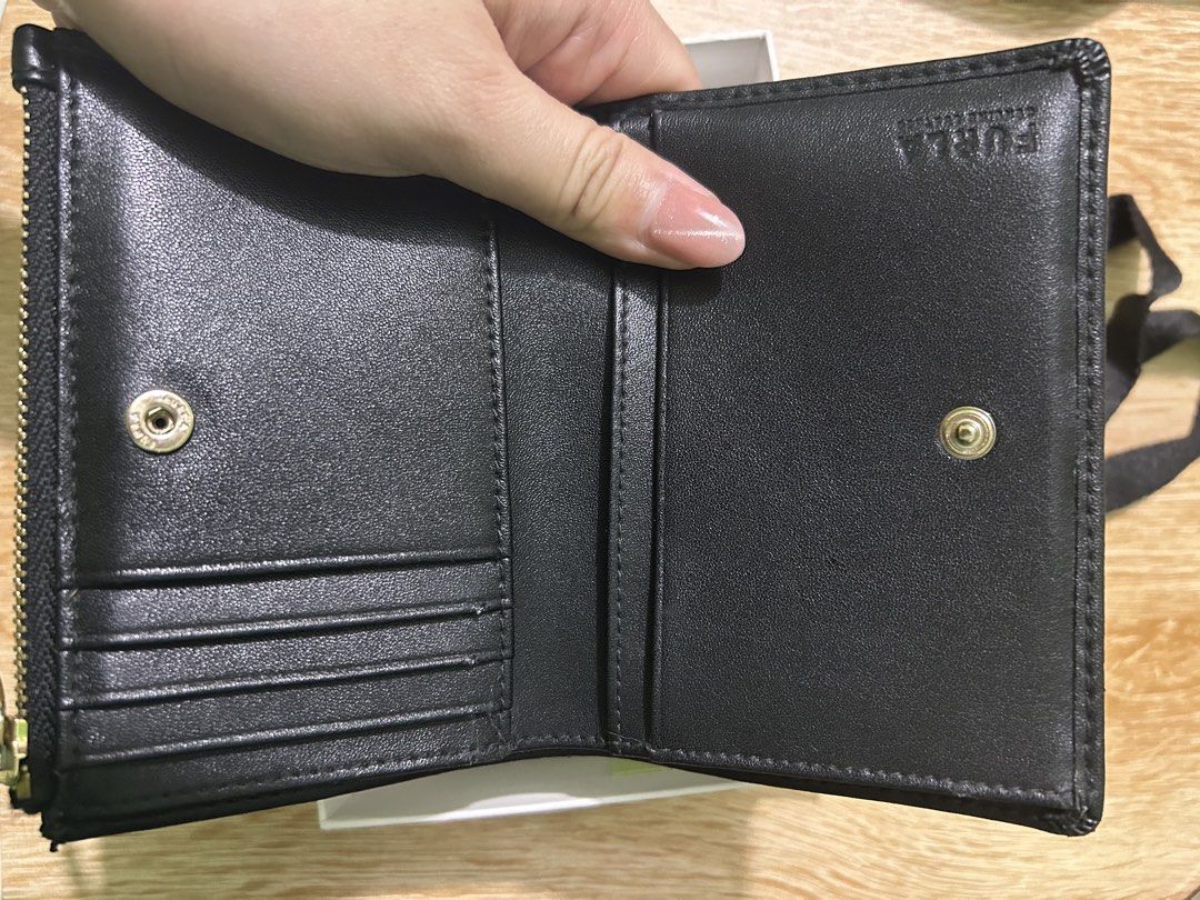 Furla Black Leather Bi-fold Wallet with Box (Category: Luxury Bags & Wallets) located in Imus. Submitted by storiesforstrays (Listing ID 1468634453, Image 3). Description: has inner tear but still looks good outside. Will come with original box and paper bag. Last price posted. SF will be shouldered by buyer. Courier via ggx direct. Only SF can be COD. All proceeds will go to @catsofdaanghari .