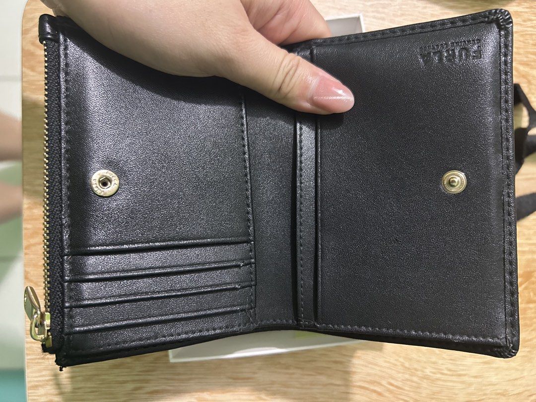 Furla Black Leather Bi-fold Wallet with Box (Category: Luxury Bags & Wallets) located in Imus. Submitted by storiesforstrays (Listing ID 1468634453, Image 2). Description: has inner tear but still looks good outside. Will come with original box and paper bag. Last price posted. SF will be shouldered by buyer. Courier via ggx direct. Only SF can be COD. All proceeds will go to @catsofdaanghari .