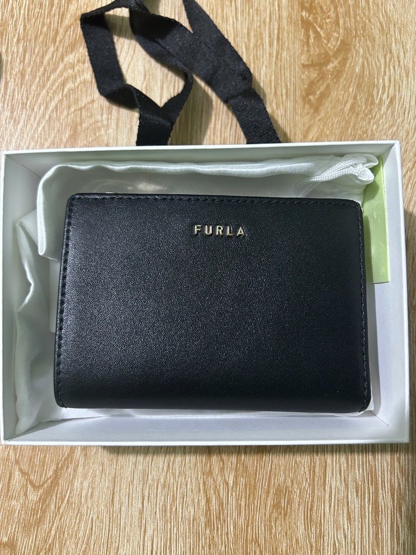 Furla Black Leather Bi-fold Wallet with Box (Category: Luxury Bags & Wallets) located in Imus. Submitted by storiesforstrays (Listing ID 1468634453, Image 1). Description: has inner tear but still looks good outside. Will come with original box and paper bag. Last price posted. SF will be shouldered by buyer. Courier via ggx direct. Only SF can be COD. All proceeds will go to @catsofdaanghari .