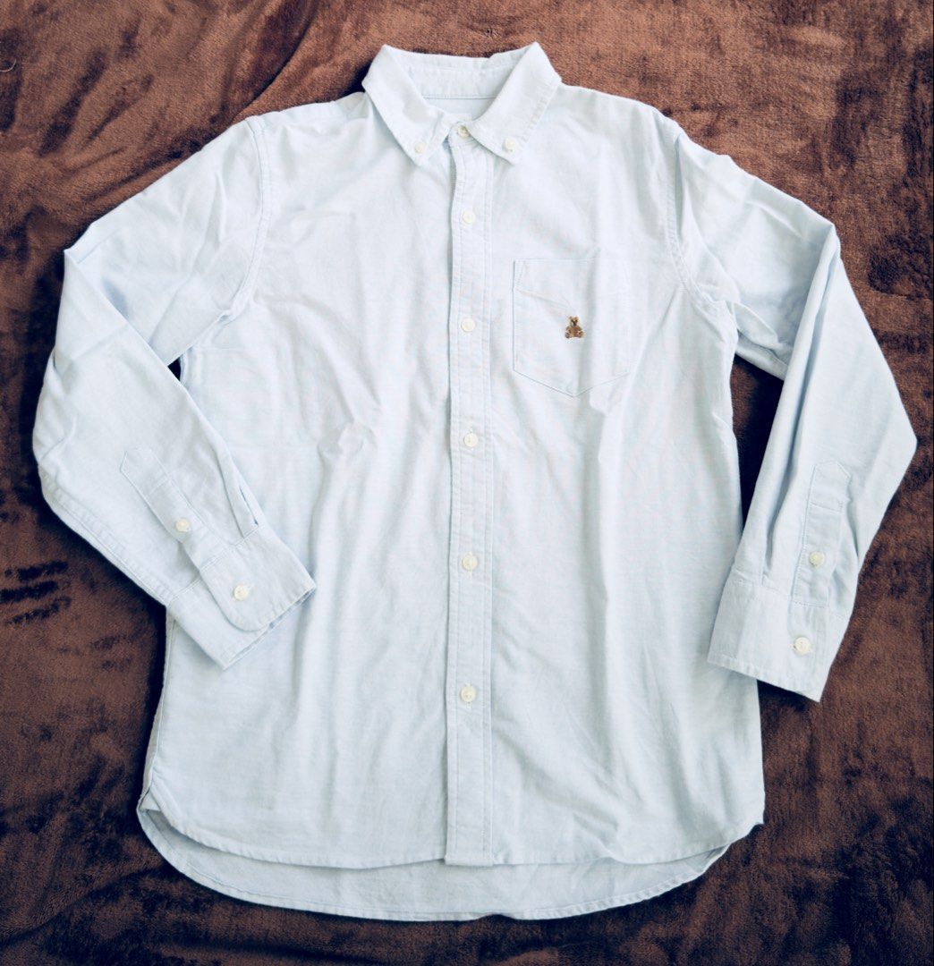 Gap Kids Light Blue Button-Down Shirt Size L 10 (Category: Babies & Kids Fashion) located in Cainta. Submitted by sixteenfive29 (Listing ID 1468602843, Image 1). Description: Super nice in actual Light blue - Brand: Gap Kids - Color: Light Blue - Size: L (fits around age 10) - Design: Classic collar, long sleeves, front button closure, and a sweet embroidered bear on the single chest pocket - Material & Origin: Made in Sri Lanka - Perfect for: Sc