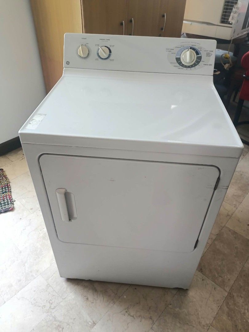 GE Clothes Dryer Extra Large Capacity (Category: Washing Machines and Dryers) located in Manila. Submitted by joe.kelly (Listing ID 1468591556, Image 3). Description: - Brand/Model: GE Clothes Dryer - Capacity: Extra large, ideal for big load laundry - Design: White body, front-loading with side handle and top panel dial controls - Drum: Durable stainless steel interior - Settings: Multiple fabric care and heat options (Cottons, Easy Care) - Incl
