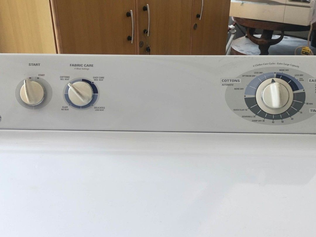 GE Clothes Dryer Extra Large Capacity (Category: Washing Machines and Dryers) located in Manila. Submitted by joe.kelly (Listing ID 1468591556, Image 2). Description: - Brand/Model: GE Clothes Dryer - Capacity: Extra large, ideal for big load laundry - Design: White body, front-loading with side handle and top panel dial controls - Drum: Durable stainless steel interior - Settings: Multiple fabric care and heat options (Cottons, Easy Care) - Incl