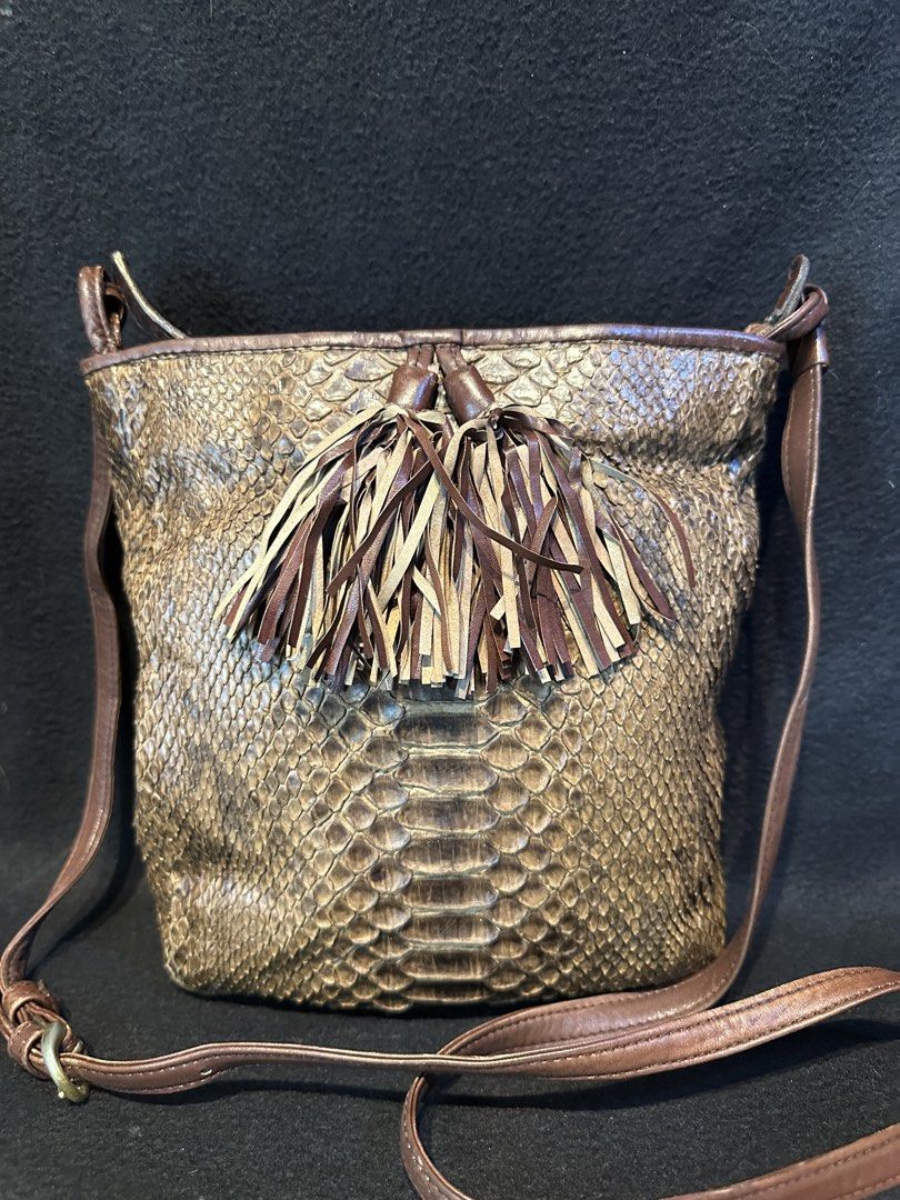 Genuine python sling bag. Vintage snake bag (Category: Luxury Bags & Wallets) located in Quezon City. Submitted by WIMC2ndaccount (Listing ID 1468580023, Image 2). Description: Japan bag Genuine snake bag Vintage bag Genuine snake skin leather Good condition 19X 22 centimeters .