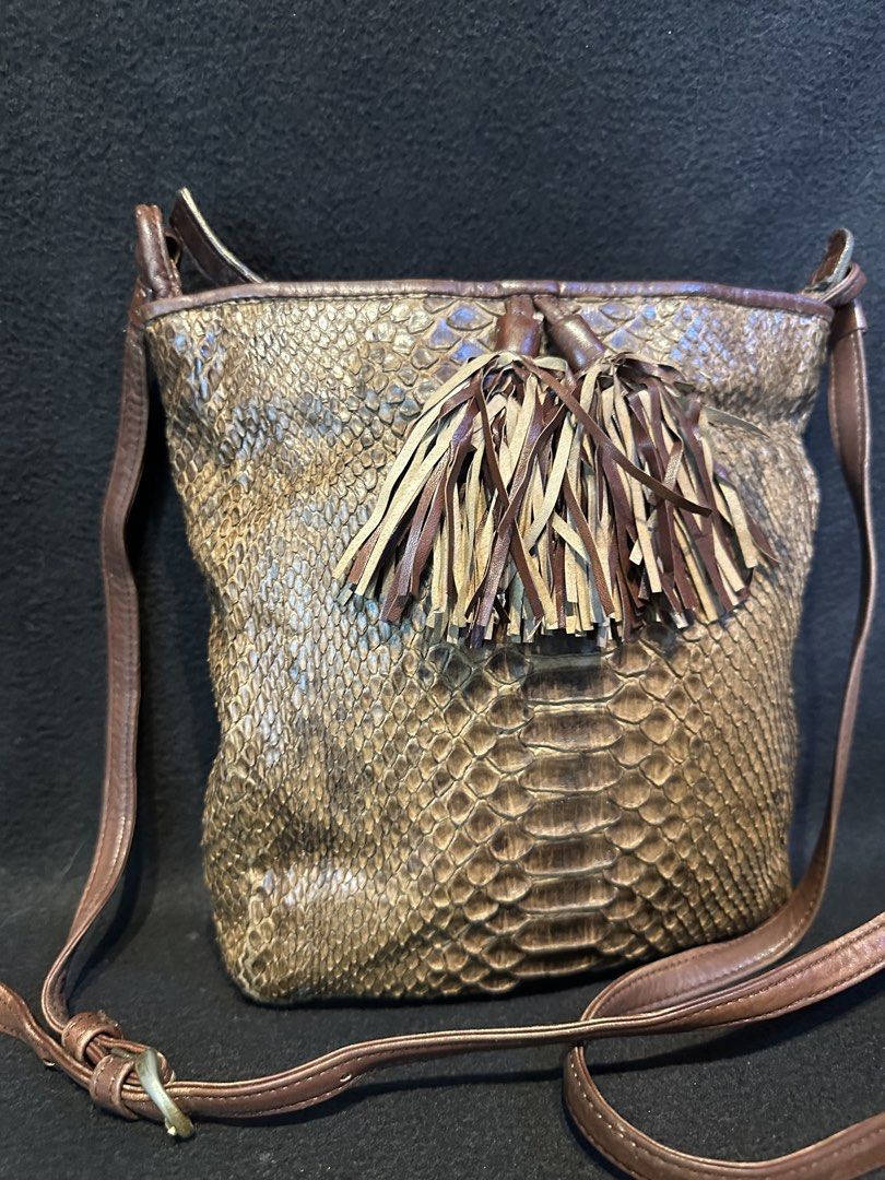 Genuine python sling bag. Vintage snake bag (Category: Luxury Bags & Wallets) located in Quezon City. Submitted by WIMC2ndaccount (Listing ID 1468580023, Image 3). Description: Japan bag Genuine snake bag Vintage bag Genuine snake skin leather Good condition 19X 22 centimeters .