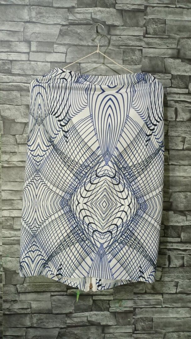 Geometric pattern pencil skirt blue and white (Category: Skirts) located in Antipolo. Submitted by reahespiritu (Listing ID 1468648483, Image 1). Description: - Eye-catching blue and white geometric optical illusion pattern - Structured fabric that holds its shape wonderfully - Stylish zip closure detail at the bottom back hem - Perfect for pairing with a simple, solid-colored top.