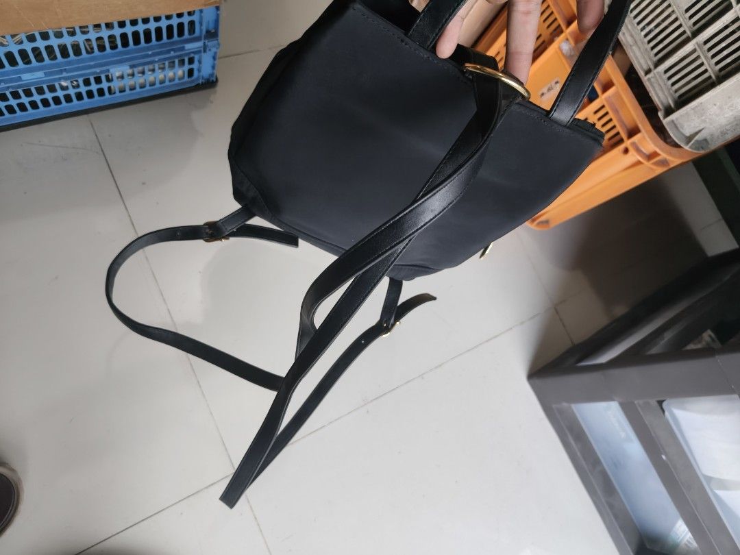Gianni Valentino Italy Black Quilted Backpack (Category: Backpacks) located in Binan City. Submitted by makinpeso0622 (Listing ID 1468600862, Image 3). Description: - Brand: Gianni Valentino - Color: Classic black with elegant gold hardware - Design: Chic stitched grid pattern with front logo badge - Storage: Convenient side zipper pocket and interior zipper compartment - Comfort: Adjustable black shoulder straps for a custom fit - Details: Inclu
