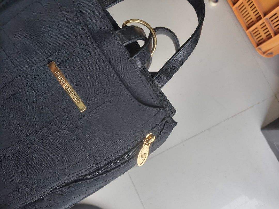 Gianni Valentino Italy Black Quilted Backpack (Category: Backpacks) located in Binan City. Submitted by makinpeso0622 (Listing ID 1468600862, Image 2). Description: - Brand: Gianni Valentino - Color: Classic black with elegant gold hardware - Design: Chic stitched grid pattern with front logo badge - Storage: Convenient side zipper pocket and interior zipper compartment - Comfort: Adjustable black shoulder straps for a custom fit - Details: Inclu