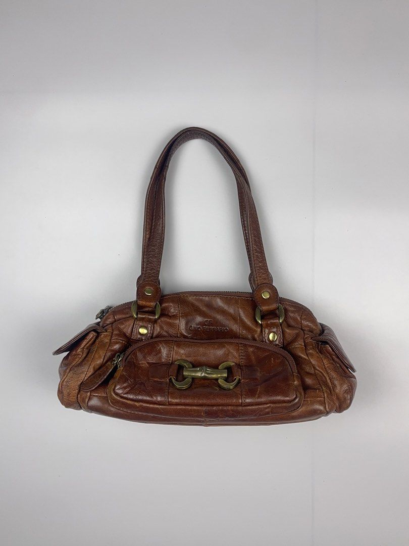 GINO FERRARIO VINTAGE LEATHER SHOULDER BAG (Category: Shoulder Bags) located in Cagayan de Oro. Submitted by kmcurations (Listing ID 1468548421, Image 1). Description: GINO FERRARIO VINTAGE LEATHER SHOULDER BAG Details & Dimensions: • Material: Genuine Washed / Distressed Leather in Chestnut Brown (paneled construction) • Interior: Dark branded jacquard fabric lining with 1 zip compartment & slip pockets • Hardware: Antique brass-tone hardware, h