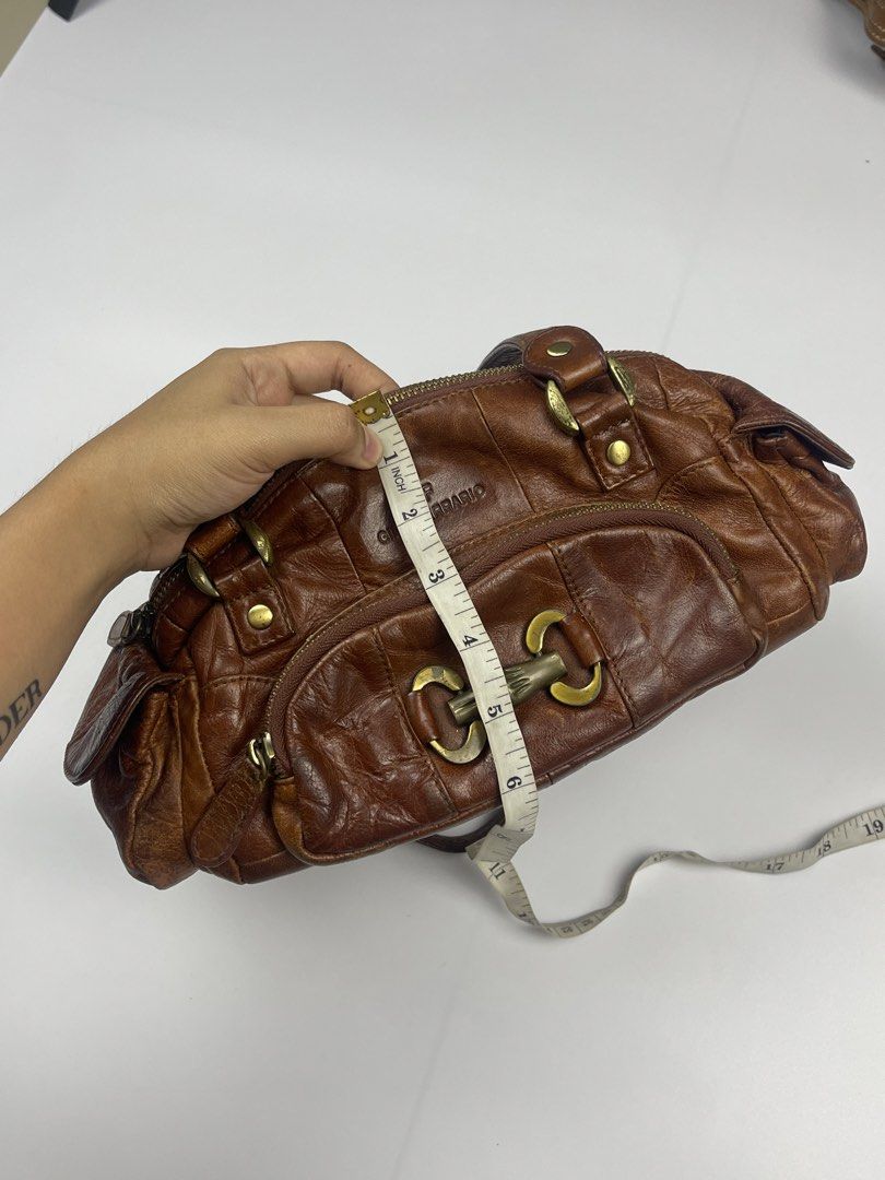 GINO FERRARIO VINTAGE LEATHER SHOULDER BAG (Category: Shoulder Bags) located in Cagayan de Oro. Submitted by kmcurations (Listing ID 1468548421, Image 3). Description: GINO FERRARIO VINTAGE LEATHER SHOULDER BAG Details & Dimensions: • Material: Genuine Washed / Distressed Leather in Chestnut Brown (paneled construction) • Interior: Dark branded jacquard fabric lining with 1 zip compartment & slip pockets • Hardware: Antique brass-tone hardware, h