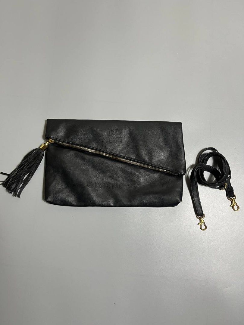 Givenchy Black Leather Envelope Clutch Crossbody Bag (Category: Cross-body Bags) located in Lucena. Submitted by sth.archvl (Listing ID 1468523122, Image 1). Description: In great condition No flaws Measurements Width: 12.5 inches Length: 8 inches .