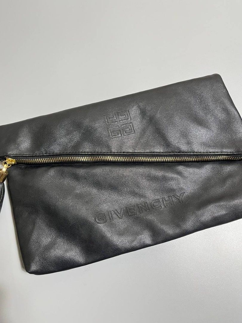 Givenchy Black Leather Envelope Clutch Crossbody Bag (Category: Cross-body Bags) located in Lucena. Submitted by sth.archvl (Listing ID 1468523122, Image 2). Description: In great condition No flaws Measurements Width: 12.5 inches Length: 8 inches .