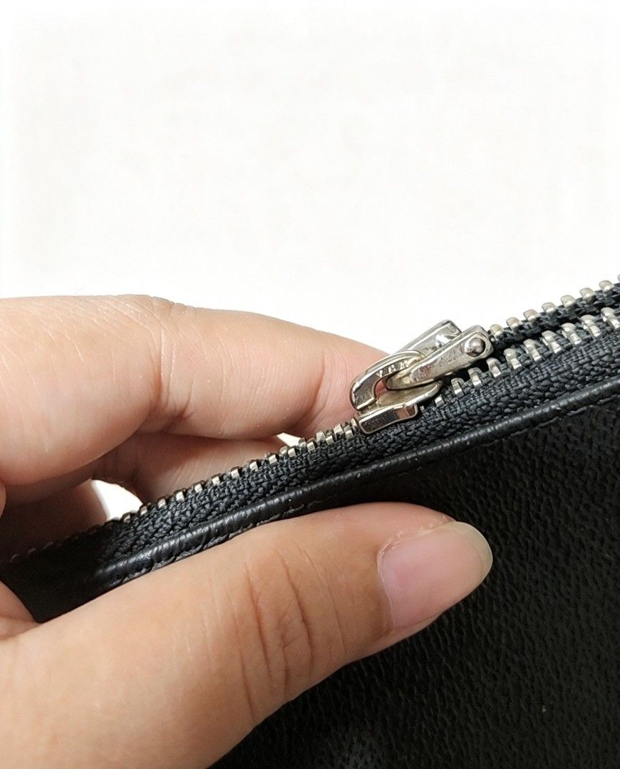 Givenchy Black Leather Pyramid Eye Print Pouch Clutch Bag (Category: Luxury Bags & Wallets) located in Manila. Submitted by jialyn03310_tree (Listing ID 1468509095, Image 3). Description: - Brand: Givenchy - Material: Premium black leather with black fabric interior lining - Design: Eye-catching large triangular eye graphic in red, white, and multicolored tones - Details: Gold stamped Givenchy lettering, silver hardware, embossed logo tag, and se